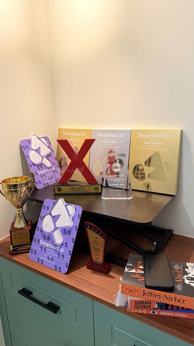 Smartlead Top 1% partner awards, plaques, and framed certificates recognizing Atishay Jain.