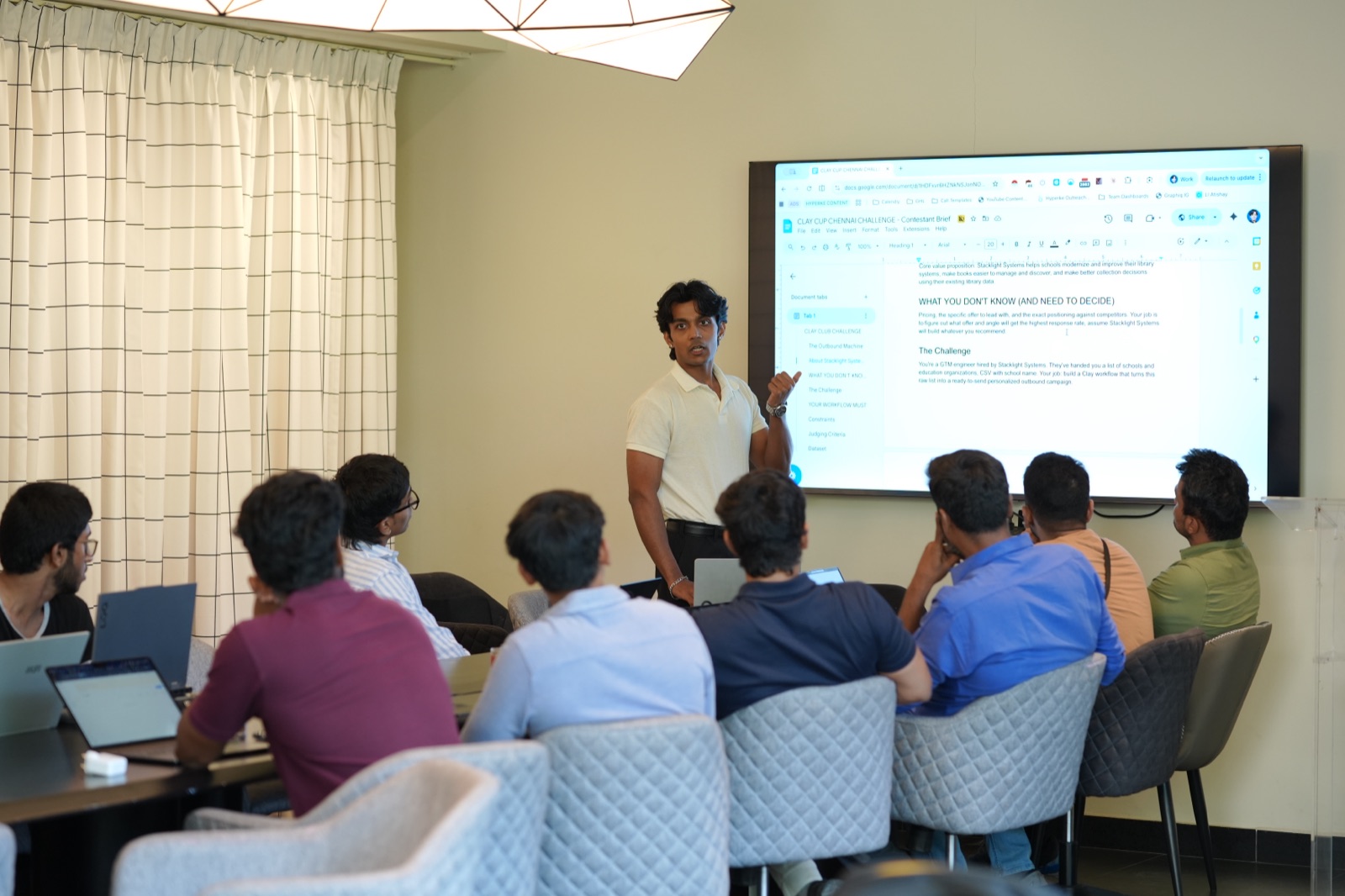 Atishay Jain leading a workshop; the on-screen prompt reads 'What you don't know (and need to decide)'